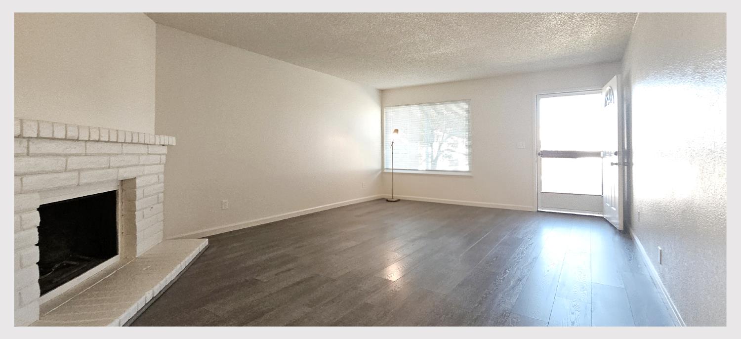 5130 Rescue Court Sacramento, CA 95841 - Photo 7 of 47 a view of an empty room with wooden floor and a window