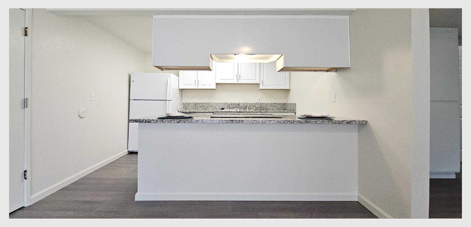 5130 Rescue Court Sacramento, CA 95841 - Photo 10 of 47 a view of kitchen island with wooden floor
