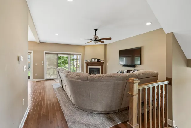 a living room with furniture window and a fireplace