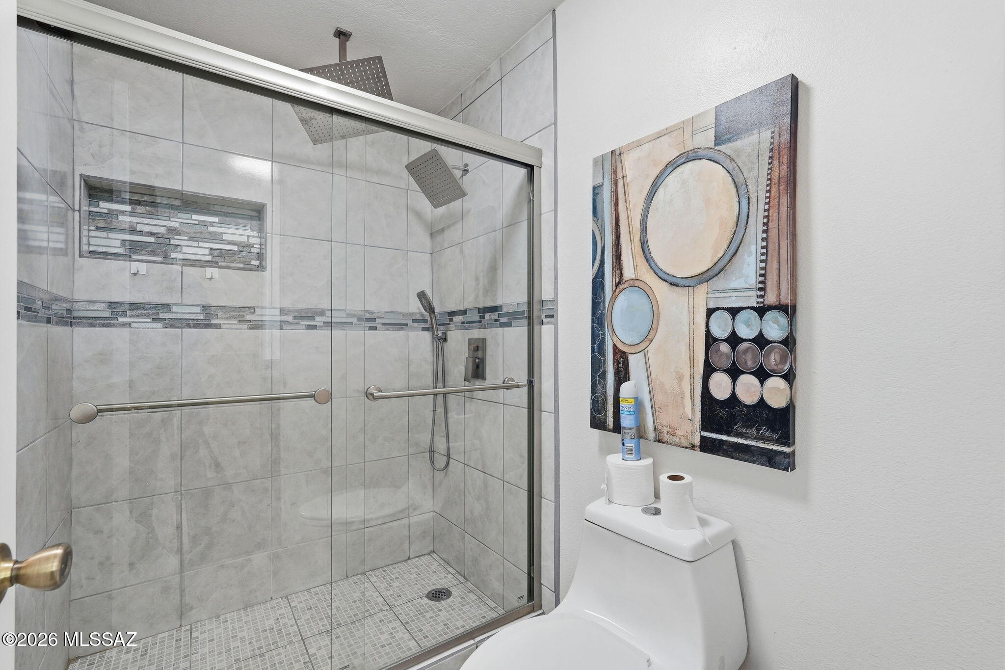 1183 Circulo Canario Rio Rico, AZ 85648 - Photo 13 of 31 a bathroom with a shower a sink and mirror
