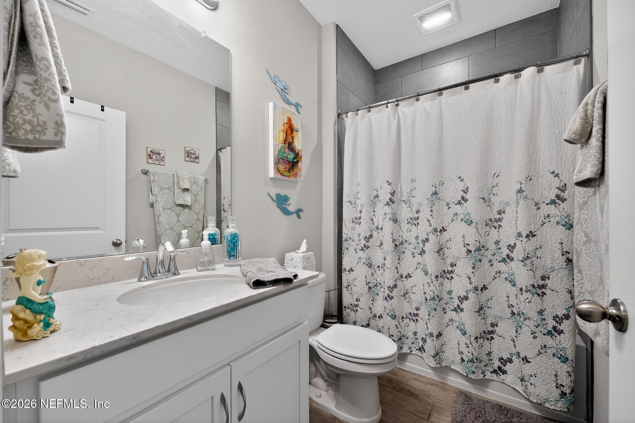 75505 Banyan Way Yulee, FL 32097 - Photo 22 of 30 a bathroom with a sink toilet and shower
