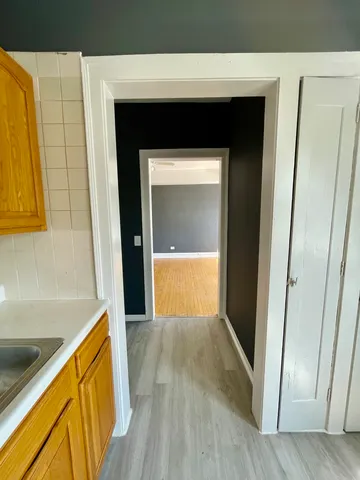 a hallway with wooden floor