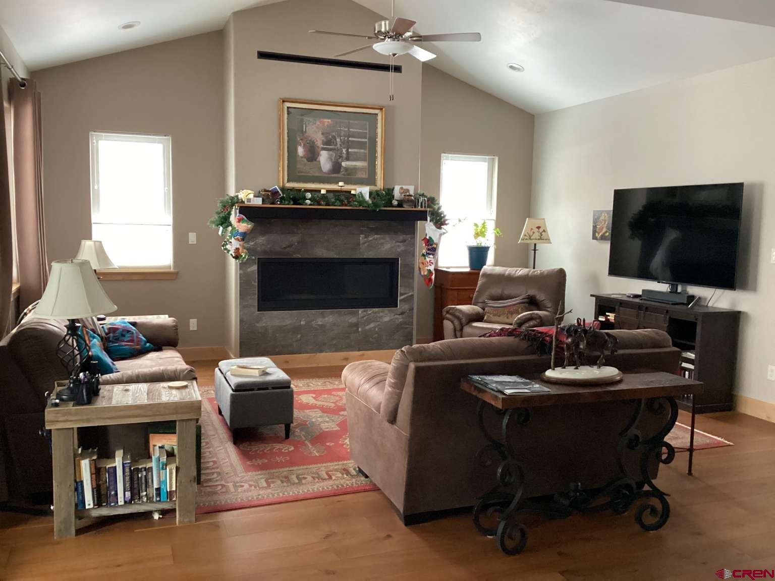 416 West 28th Street Durango, CO 81301 - Photo 2 of 16 a living room with furniture and a fireplace