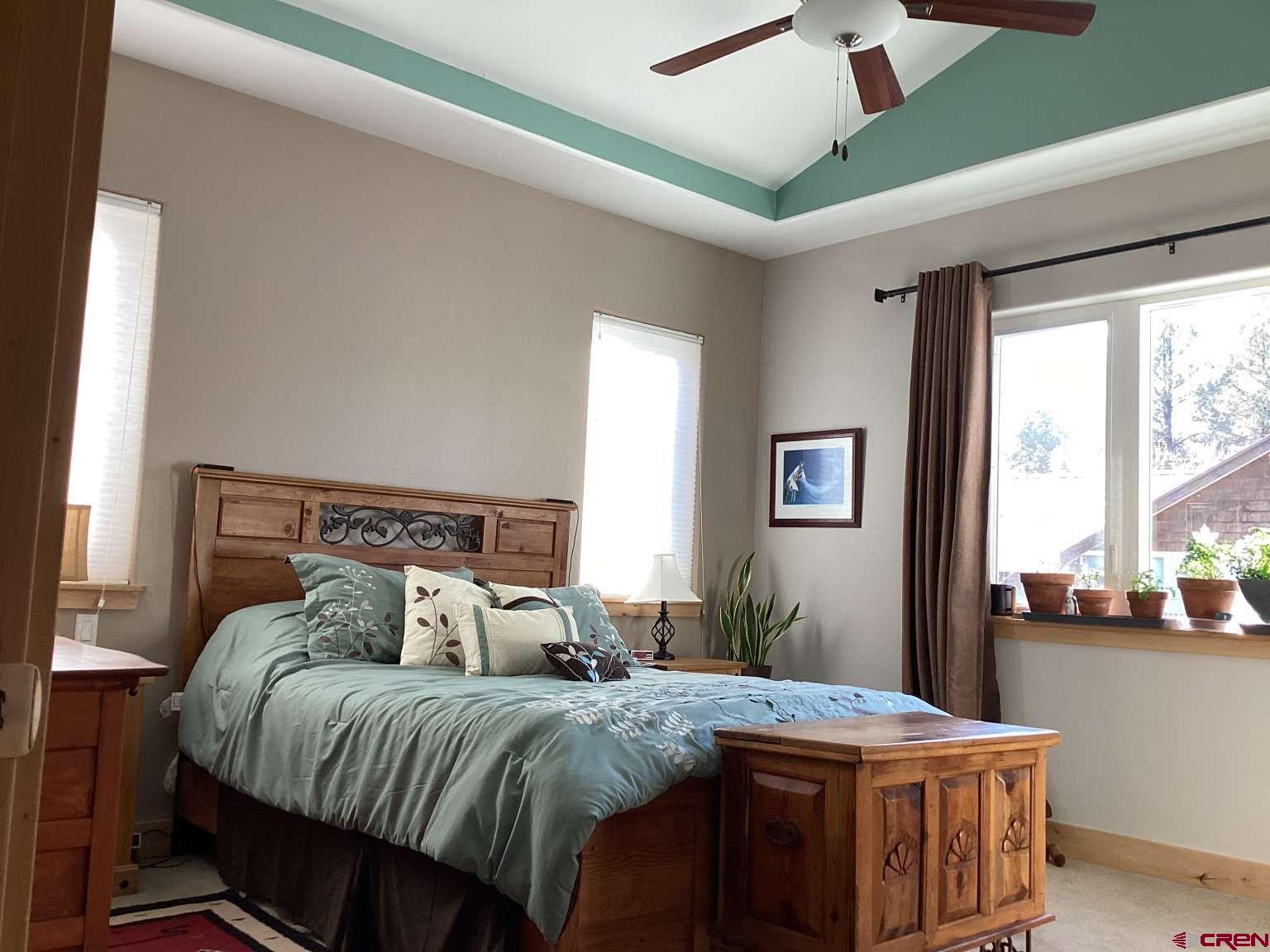 416 West 28th Street Durango, CO 81301 - Photo 5 of 16 a bed sitting in a bedroom next to a window