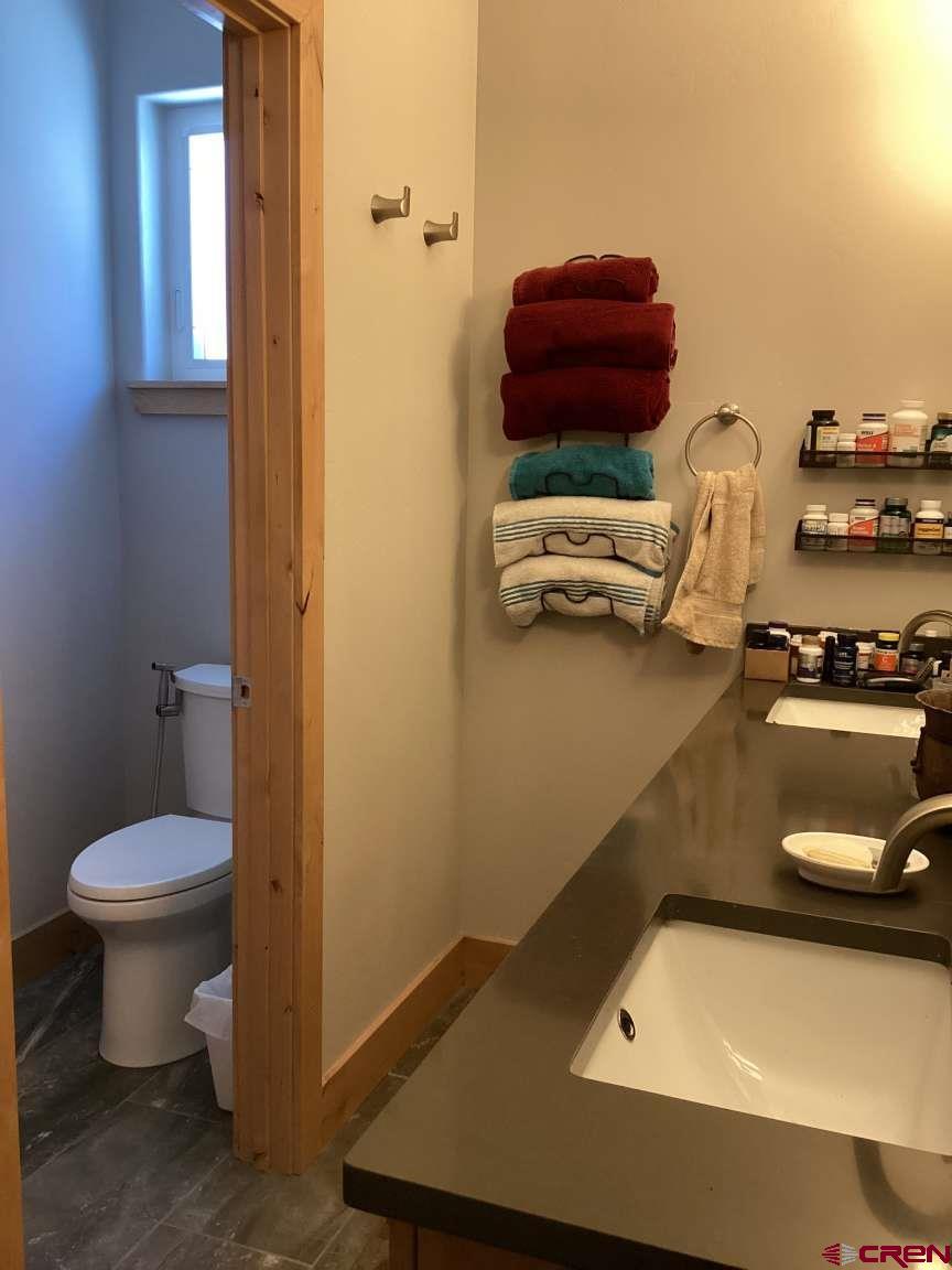 416 West 28th Street Durango, CO 81301 - Photo 6 of 16 a bathroom with a sink and a toilet