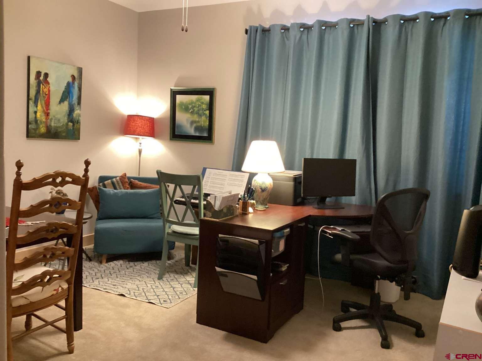 416 West 28th Street Durango, CO 81301 - Photo 10 of 16 a view of a workspace with furniture and a window
