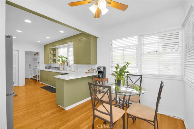 a view of a dining room with furniture and a window