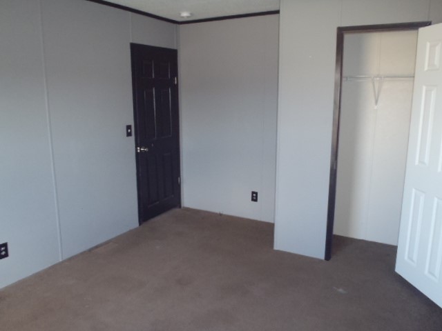 964 Railyard Drive Kyle, TX 78640 - Photo 21 of 25 Unfurnished bedroom with carpet floors and a closet