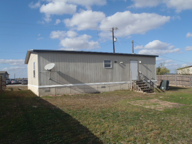 964 Railyard Drive Kyle, TX 78640 - Photo 8 of 25 Back of property featuring crawl space and entry steps