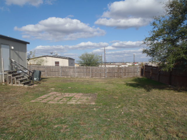 964 Railyard Drive Kyle, TX 78640 - Photo 9 of 25 Fenced backyard with a patio area