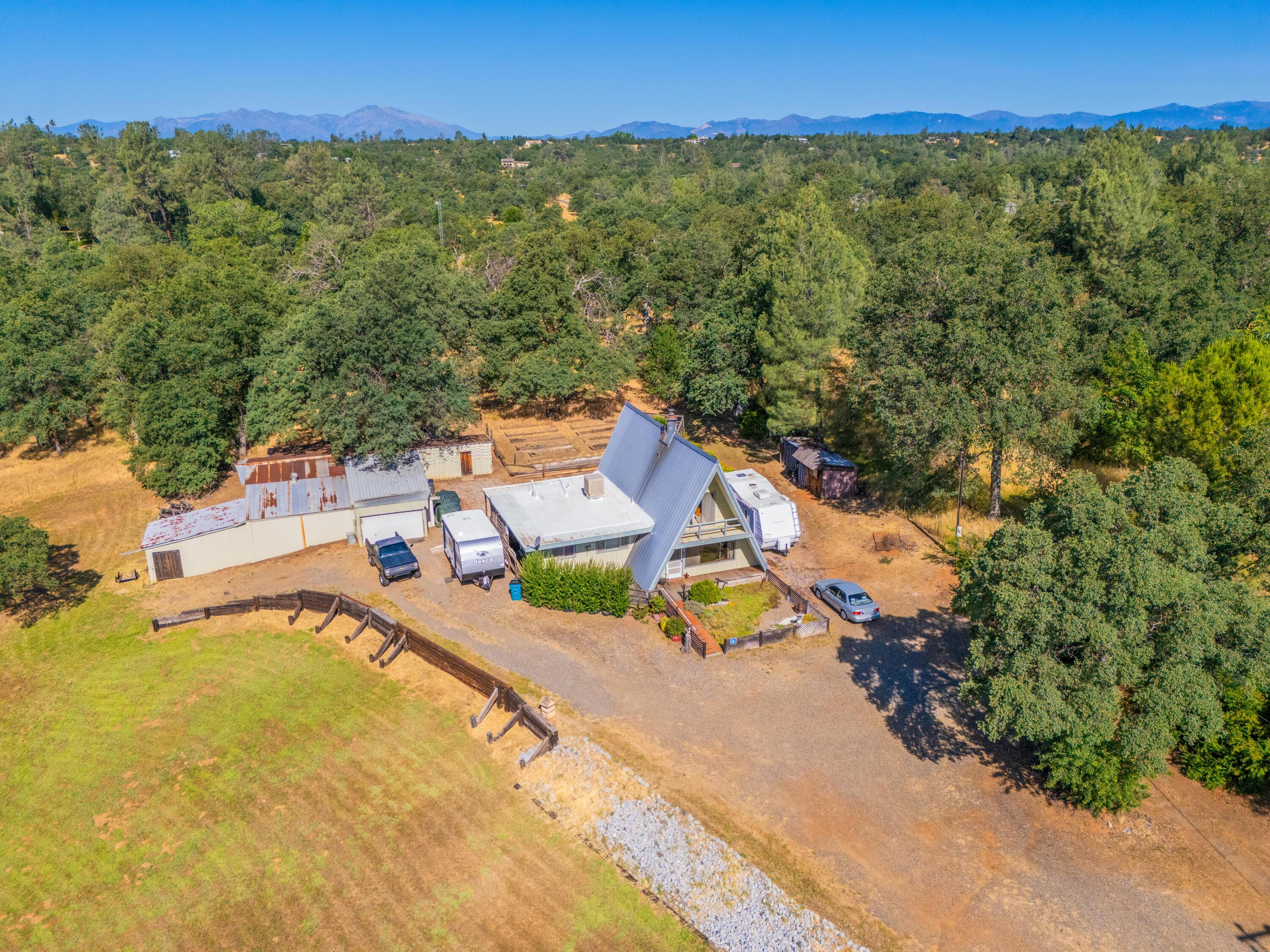 an aerial view of a house with a swimming pool
