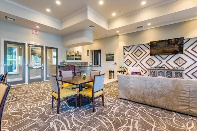 a lobby with furniture and a floor to ceiling window