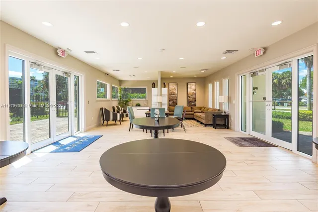 a view of a swimming pool with chairs