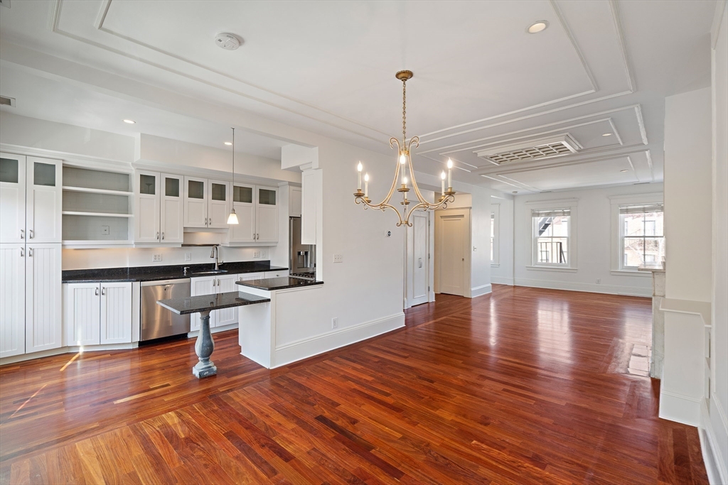 65 Rutland Street, Unit 3 Boston, MA 02118 - Photo 18 of 25 a view of a room with wooden floor and staircase