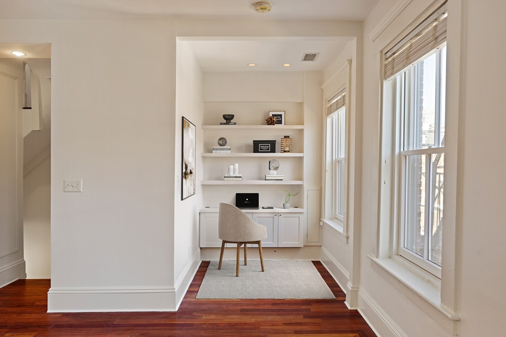 65 Rutland Street, Unit 3 Boston, MA 02118 - Photo 3 of 25 a view of a room with wooden floor and windows