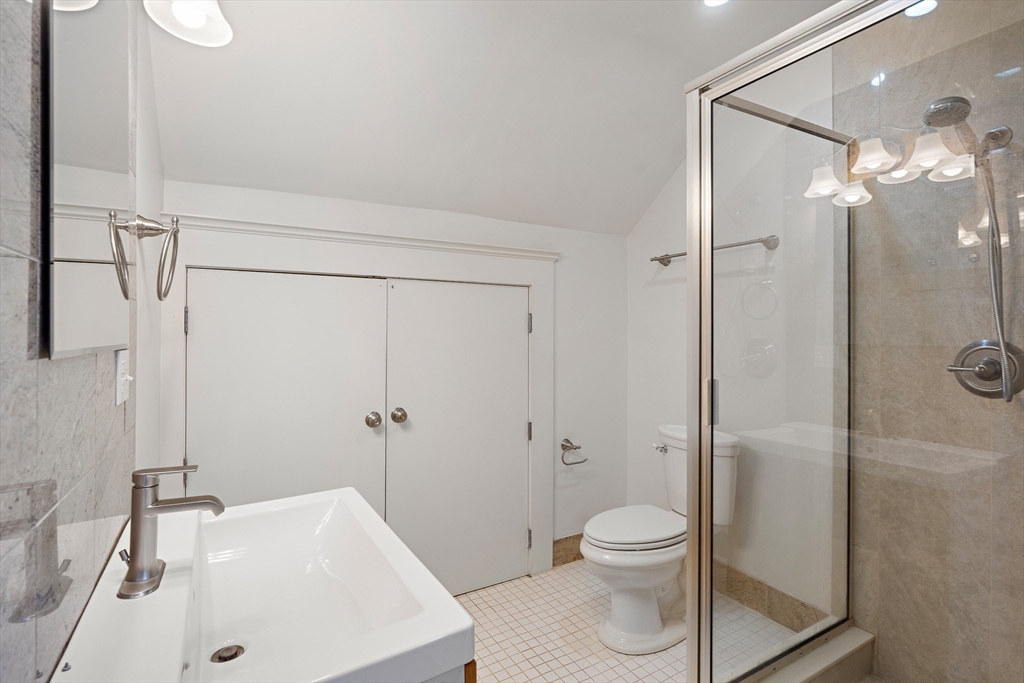 65 Rutland Street, Unit 3 Boston, MA 02118 - Photo 8 of 25 a bathroom with a sink a toilet and shower