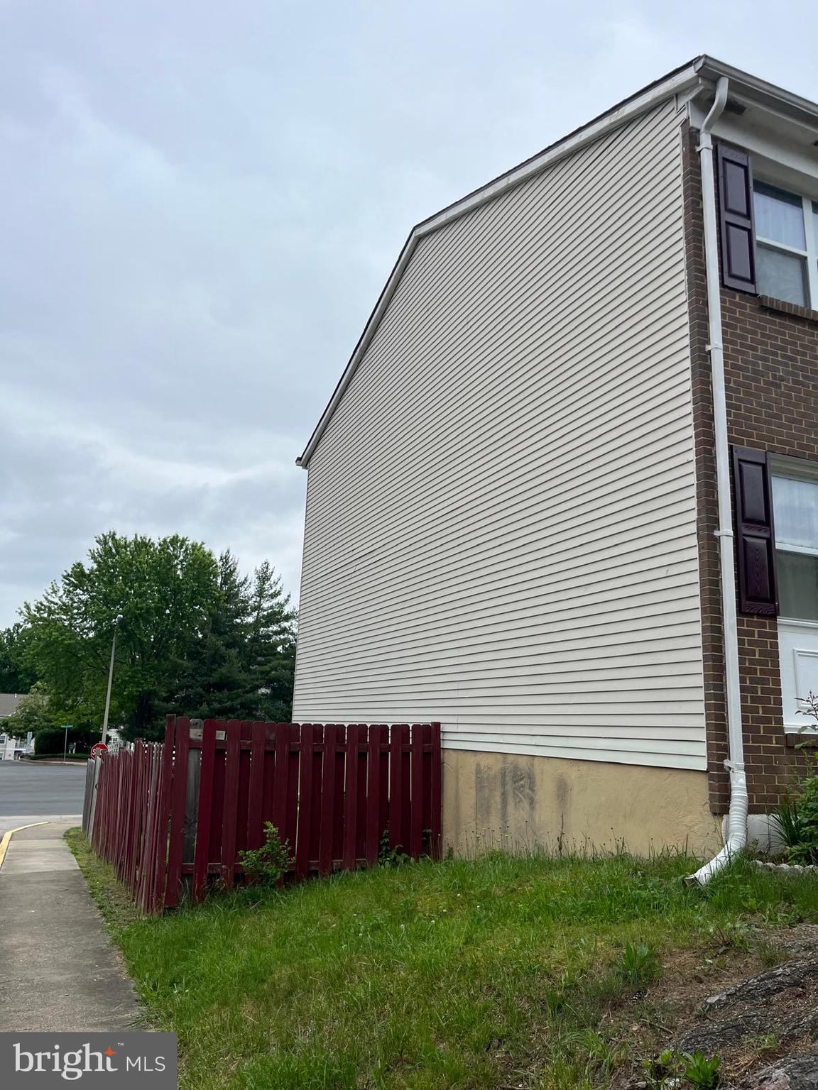 2834 Beechtree Lane Woodbridge, VA 22191 - Photo 3 of 3 a view of backyard with potted plants and wooden fence