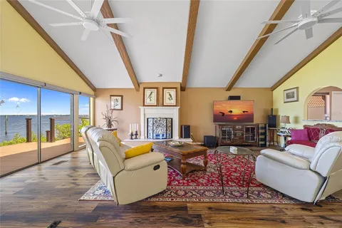 a bedroom with a bed and a chair