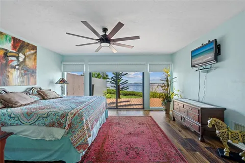 a view of a house with a wooden deck