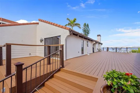 a view of a chairs and table in a patio