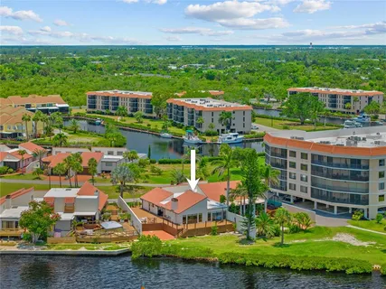 an aerial view of a house with a ocean view