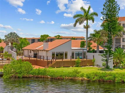 a view of a swimming pool with outdoor seating