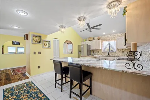 a living room with fireplace furniture and a flat screen tv