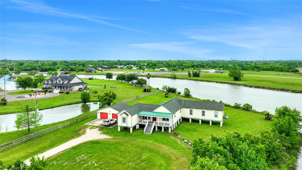 Welcome home to this GORGEOUS WATERFRONT property on ACREAGE conveniently located on the Diversionary canal right across from the local boat launch! This Eclectic home is ready to captivate you with its homey bungalow vibes.