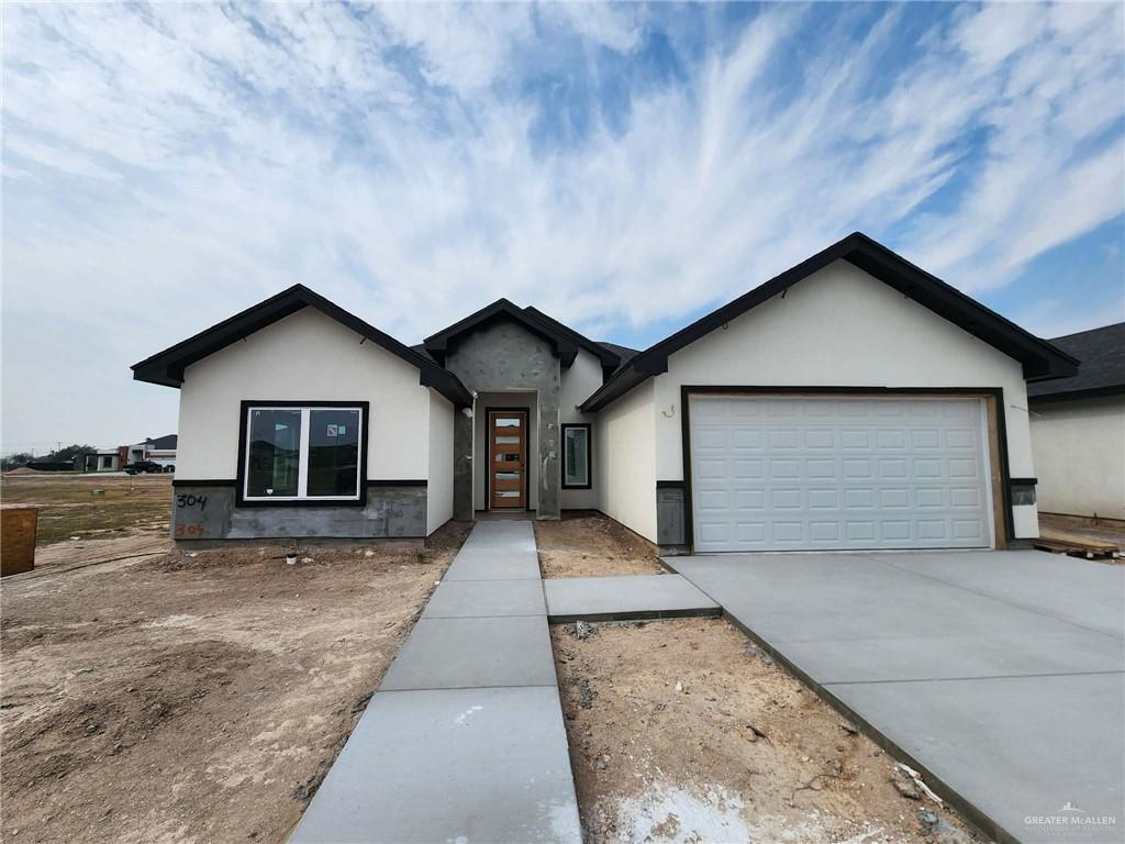 301 North 31st Street Hidalgo, TX 78557 - Photo 1 of 11 a front view of house with yard and garage
