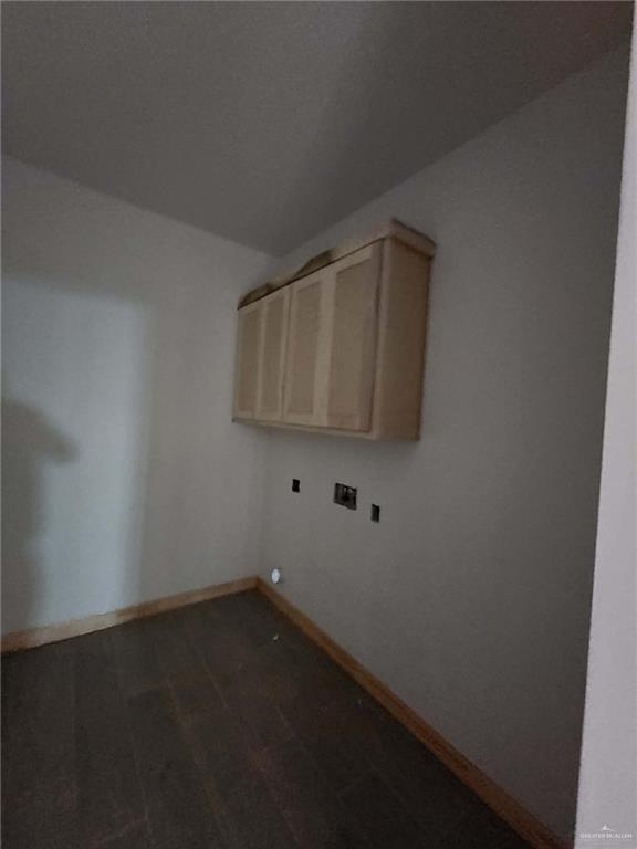 301 North 31st Street Hidalgo, TX 78557 - Photo 10 of 11 an empty room with wooden floor and cabinet