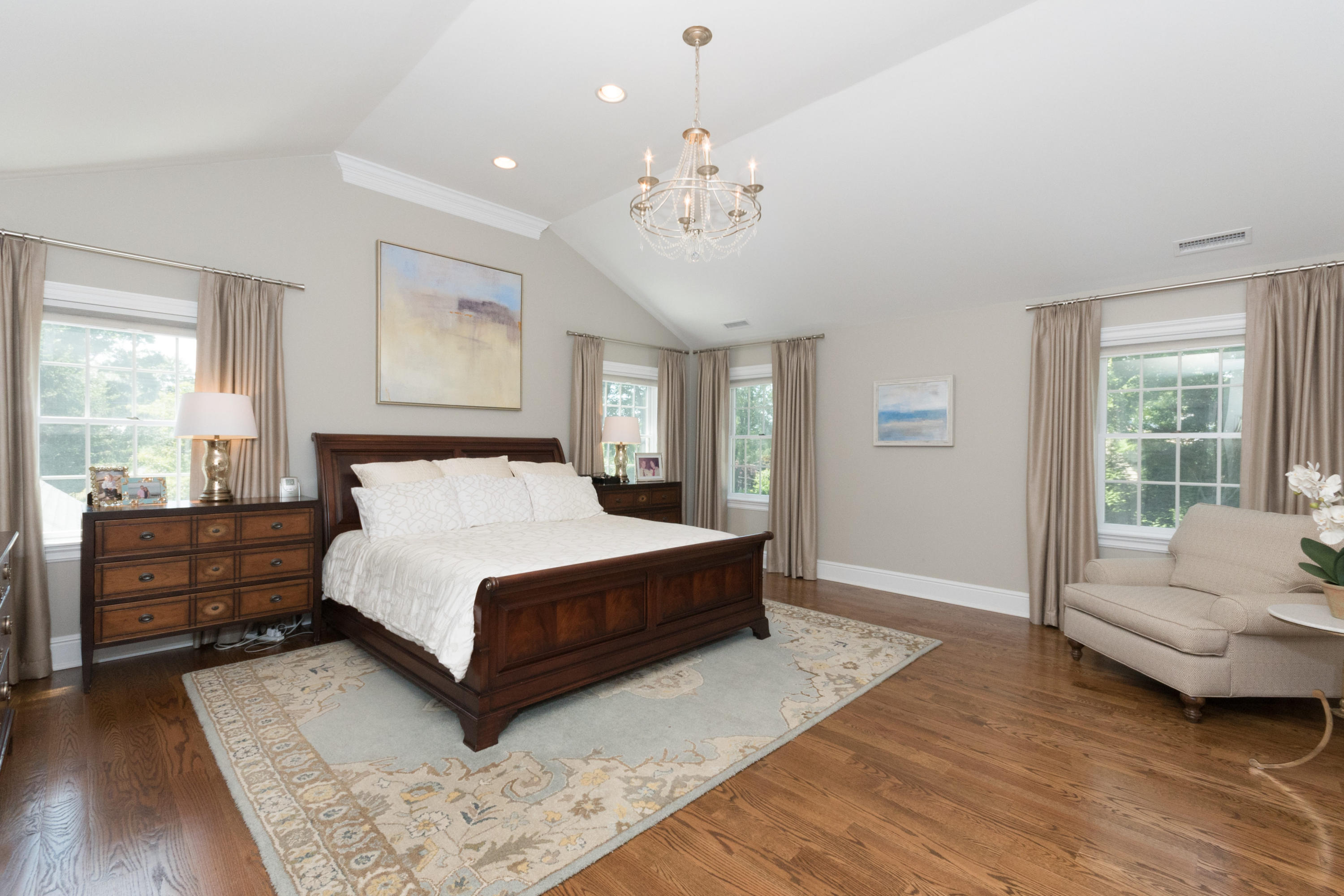 3 Stanton Road Darien, CT 06820 - Photo 14 of 32 a spacious bedroom with a large bed and a couch