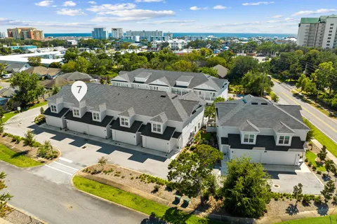 a aerial view of a house with a garden and outdoor space