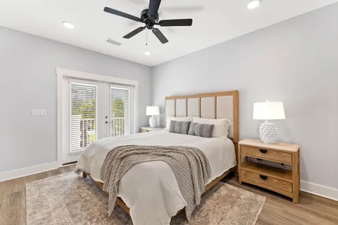 a bedroom with a large bed and a window