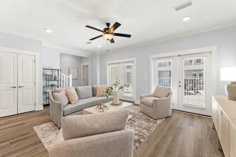 a living room with furniture and a large window