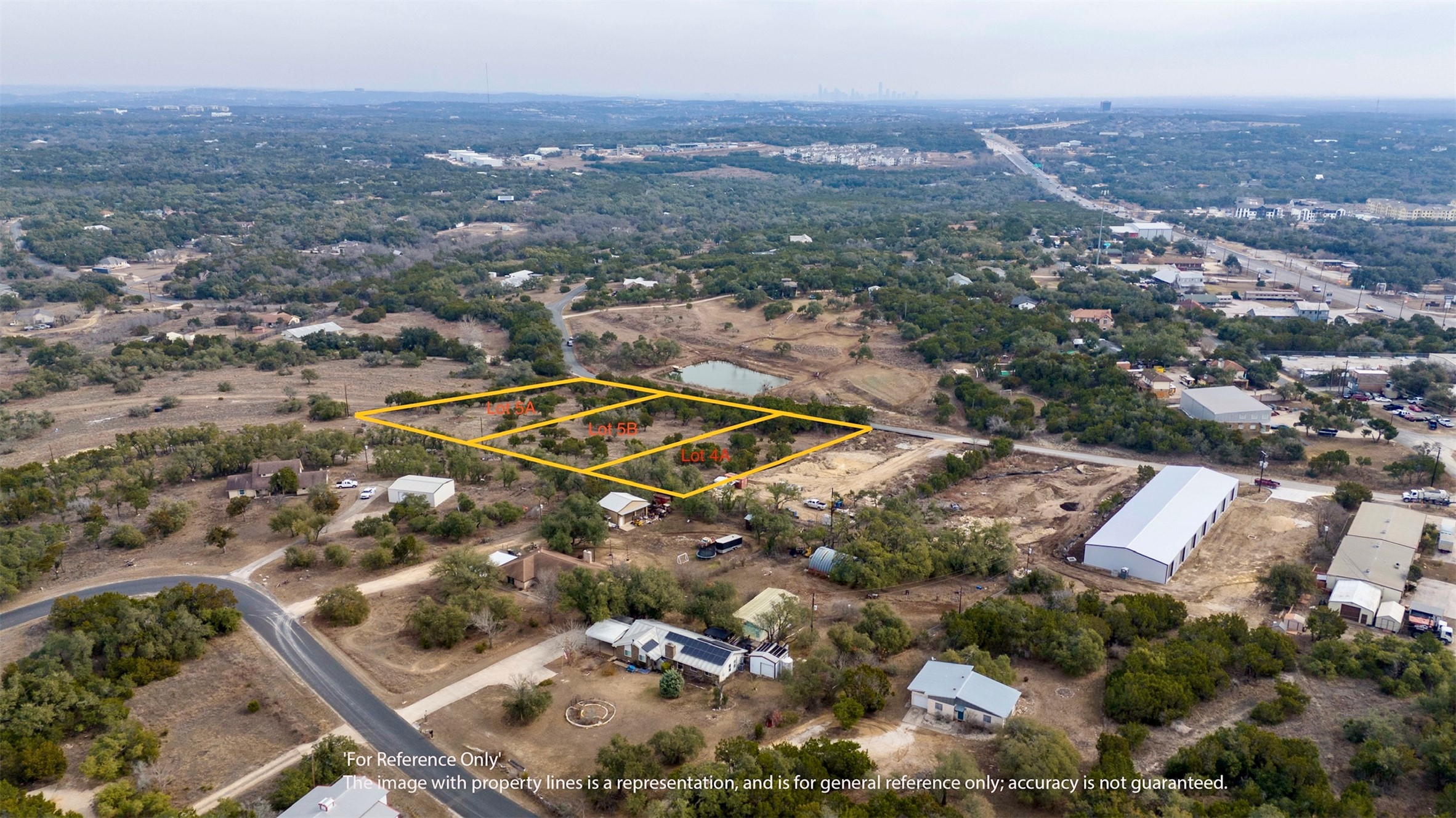 Tbd Lot 4 A Tbd Road Austin, TX 78736 - Photo 2 of 5 Aerial view of property and surrounding area with property boundaries highlighted and a large body of water