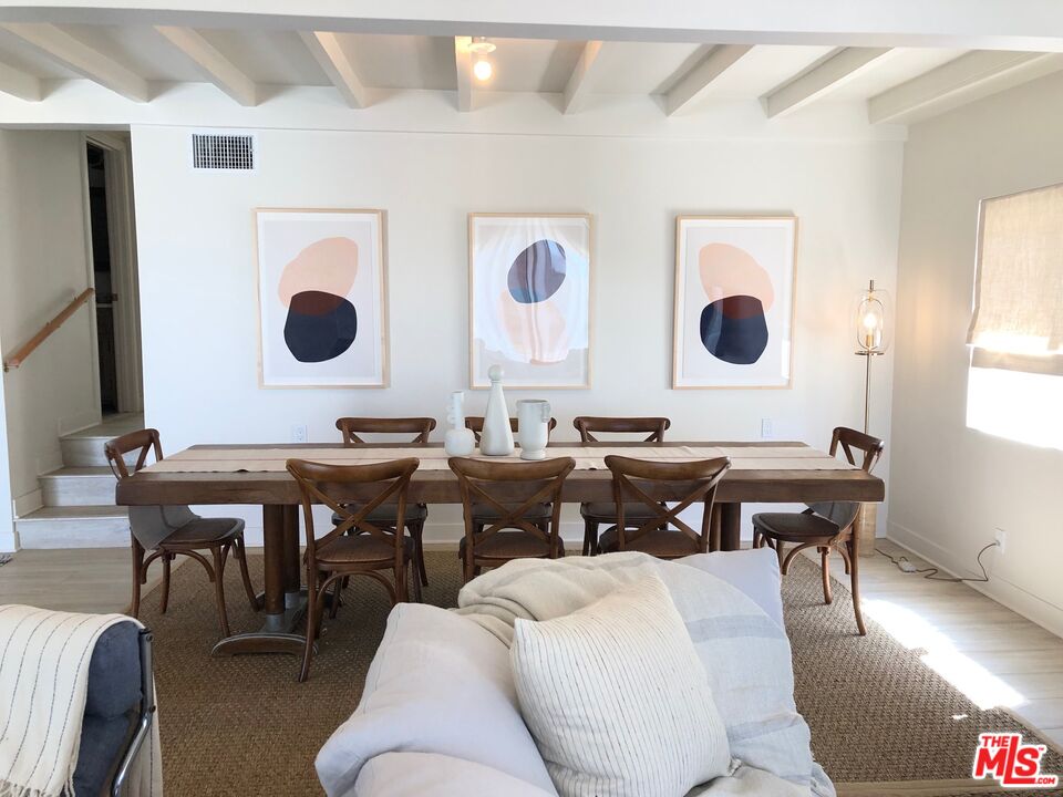 7133 Birdview Avenue Malibu, CA 90265 - Photo 4 of 9 a living room with a couch and a table