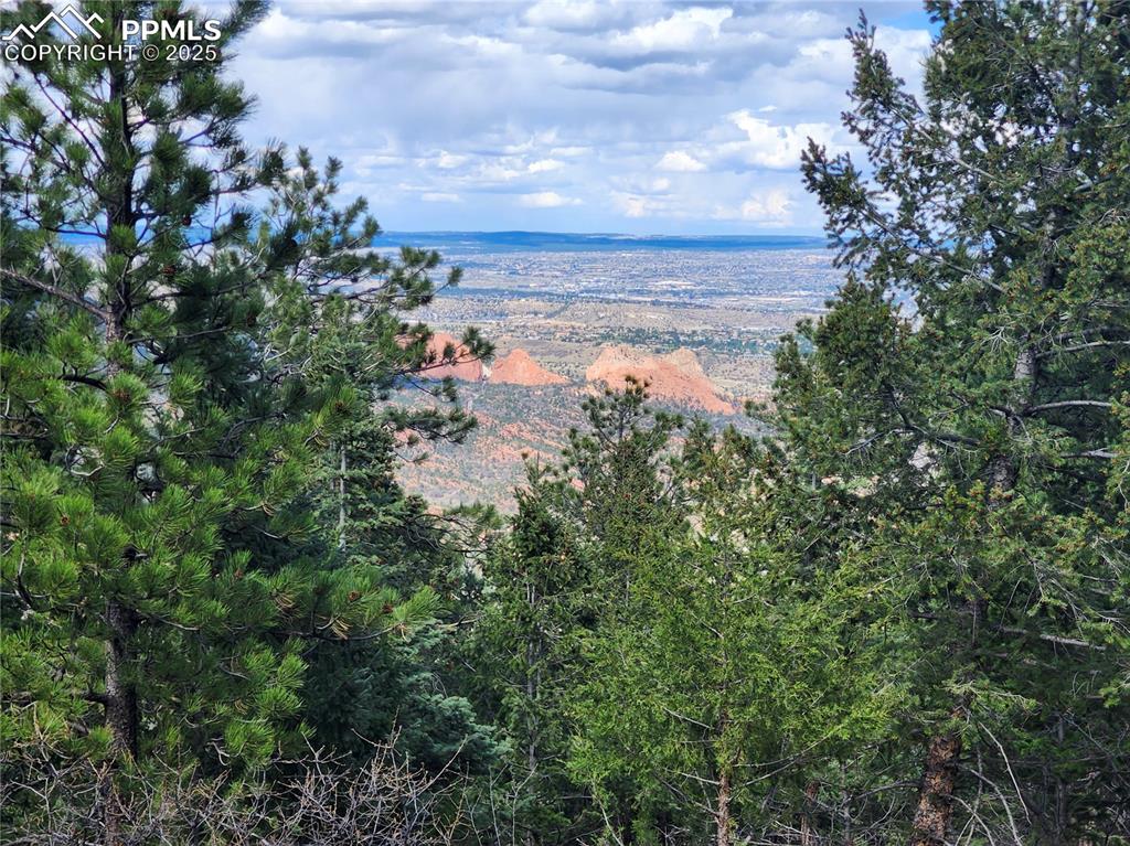 292 Sugar Loaf Road Manitou Springs, CO 80829 - Photo 2 of 12 a view of a lake in between the bunch of trees
