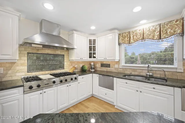 a large kitchen with granite countertop lots of counter top space