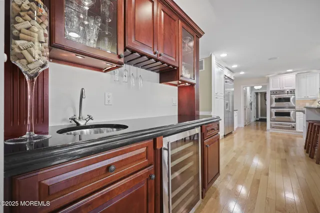 a bathroom with a double vanity sink toilet and shower