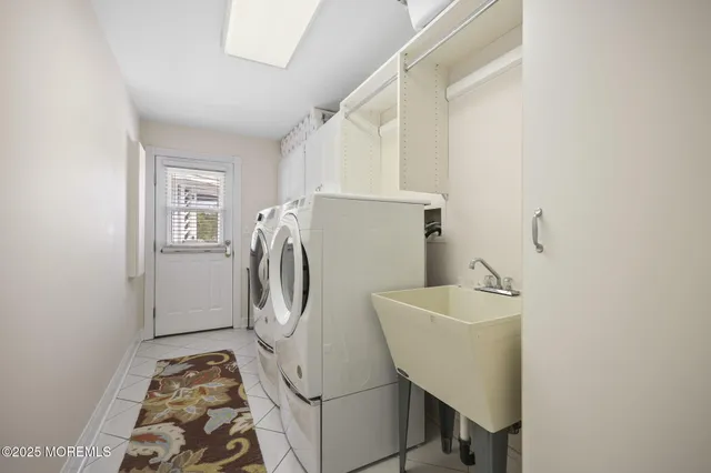 a dining room with furniture and a potted plant