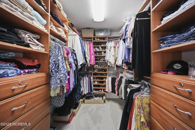 a bathroom with a granite countertop sink and a large mirror