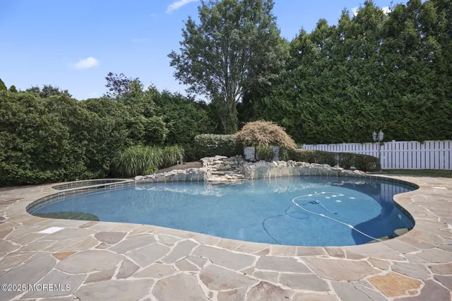 a view of a swimming pool with a yard