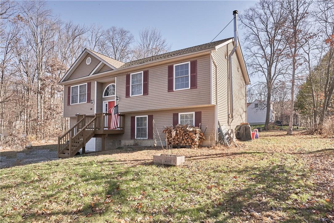 54 Alexander Road Monroe, NY 10950 - Photo 1 of 1 a house that has a tree in front of it