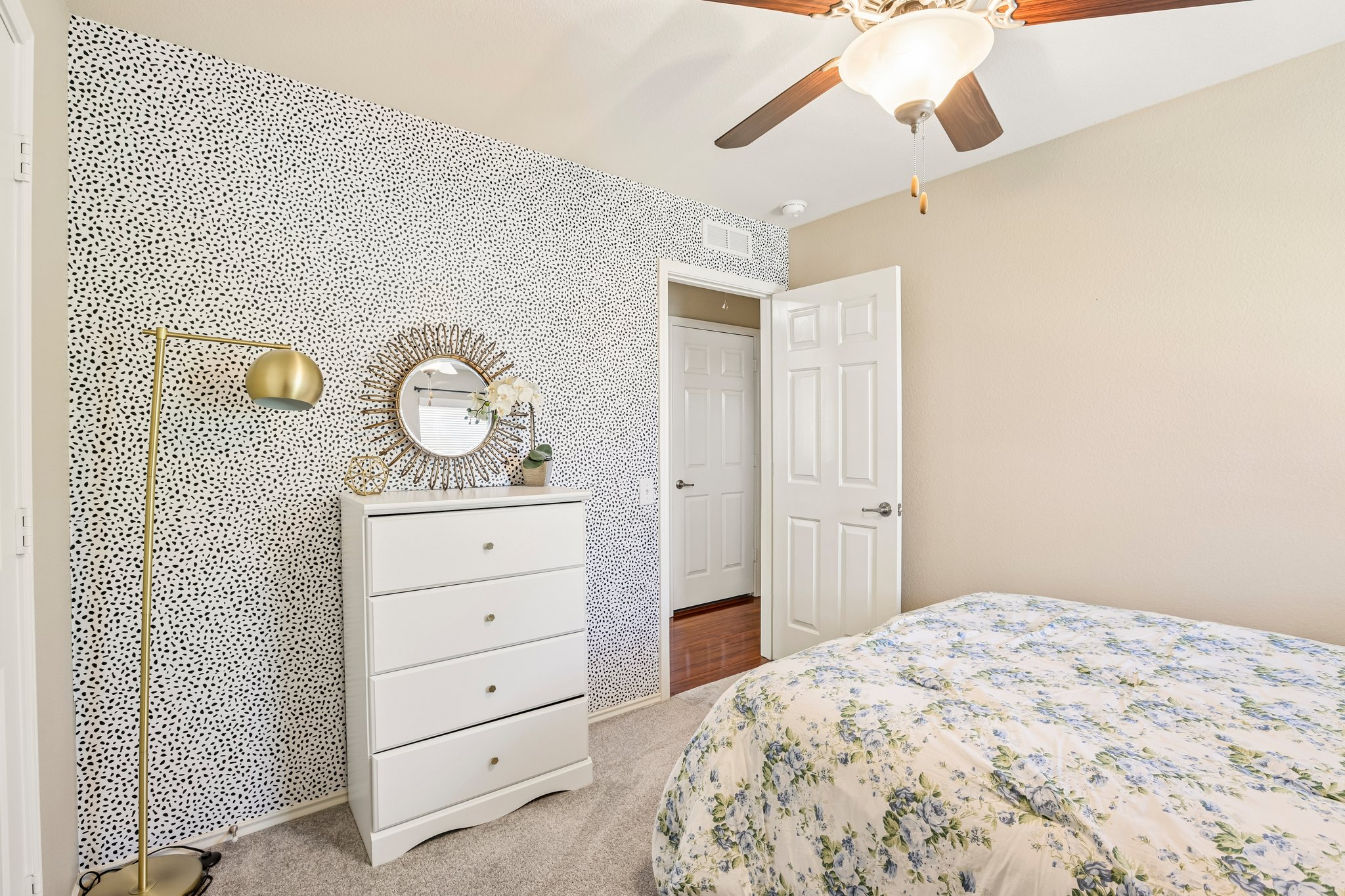 5508 Emma Thompson Way Austin, TX 78747 - Photo 30 of 34 Full of character, the secondary bedroom showcases playful wallpaper detail and is ready to be personalized to fit your style.