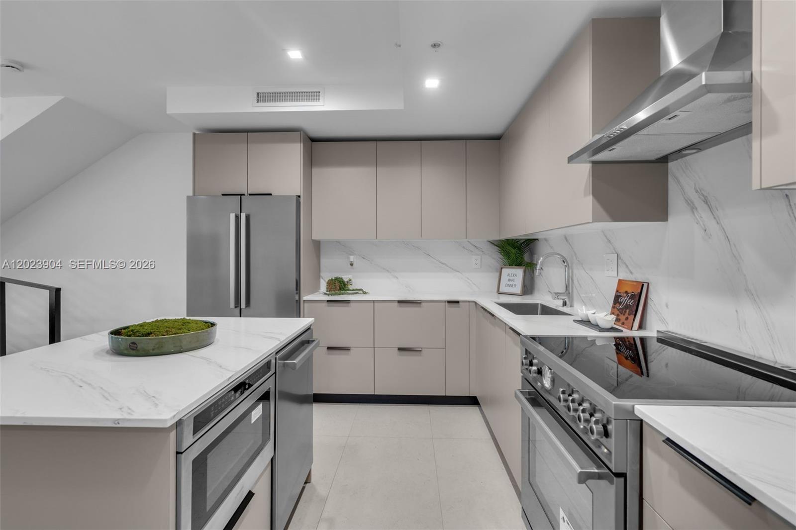 721 Southwest 11th Street, Unit G Miami, FL 33129 - Photo 13 of 40 a kitchen with a sink a stove and cabinets