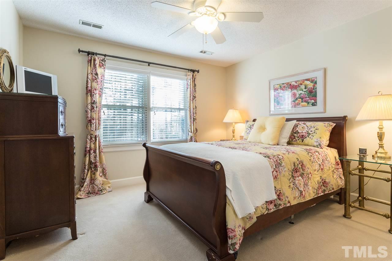 7728 Rainwater Road Raleigh, NC 27615 - Photo 21 of 30 This bedroom is generous in size and offers a ceiling fan and double windows with plantation blinds.