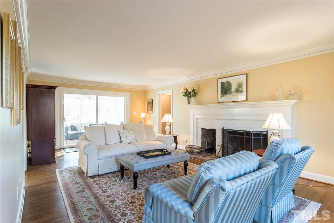 7728 Rainwater Road Raleigh, NC 27615 - Photo 6 of 30 What wonderful living space! Perfect for everyday living and social gatherings. Beautiful hardwood floors( installed by sellers), picturesque painted brick mantel, smooth ceilings and gas fireplace