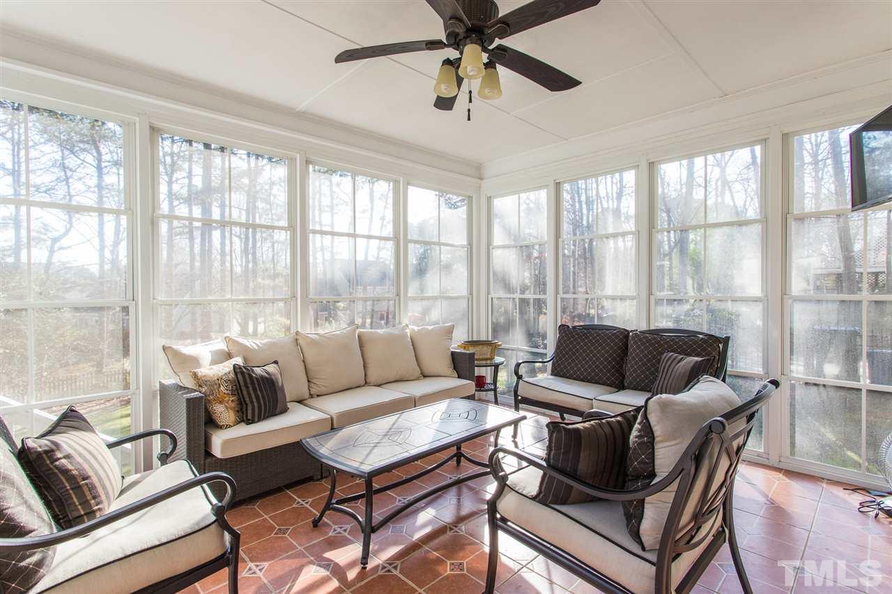 7728 Rainwater Road Raleigh, NC 27615 - Photo 8 of 30 The EZE Breeze Windows will spoil you....especially during pollen season as you can enjoy a pollen free enclosed porch! Also features a ceiling fan and tile flooring.