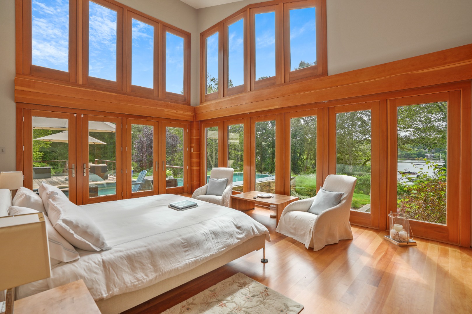 400 Barnes Road Oak Bluffs, MA 02568 - Photo 16 of 45 a large bedroom with bed and large windows