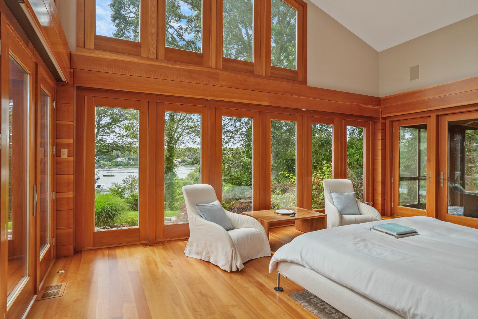 400 Barnes Road Oak Bluffs, MA 02568 - Photo 17 of 45 a bedroom with furniture and large windows